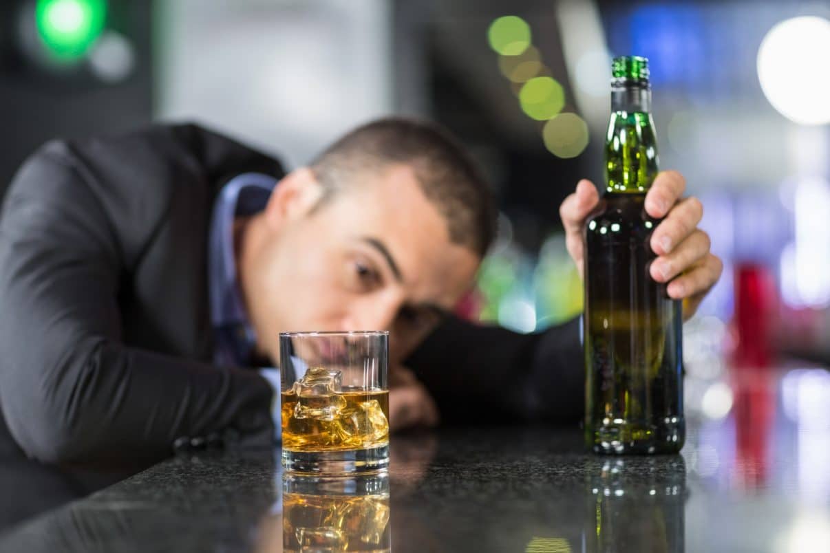 Man depressed while drinking