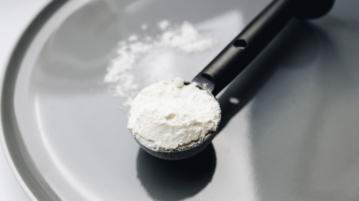 powder put in a measuring spoon
