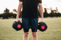 Person holding dumbells